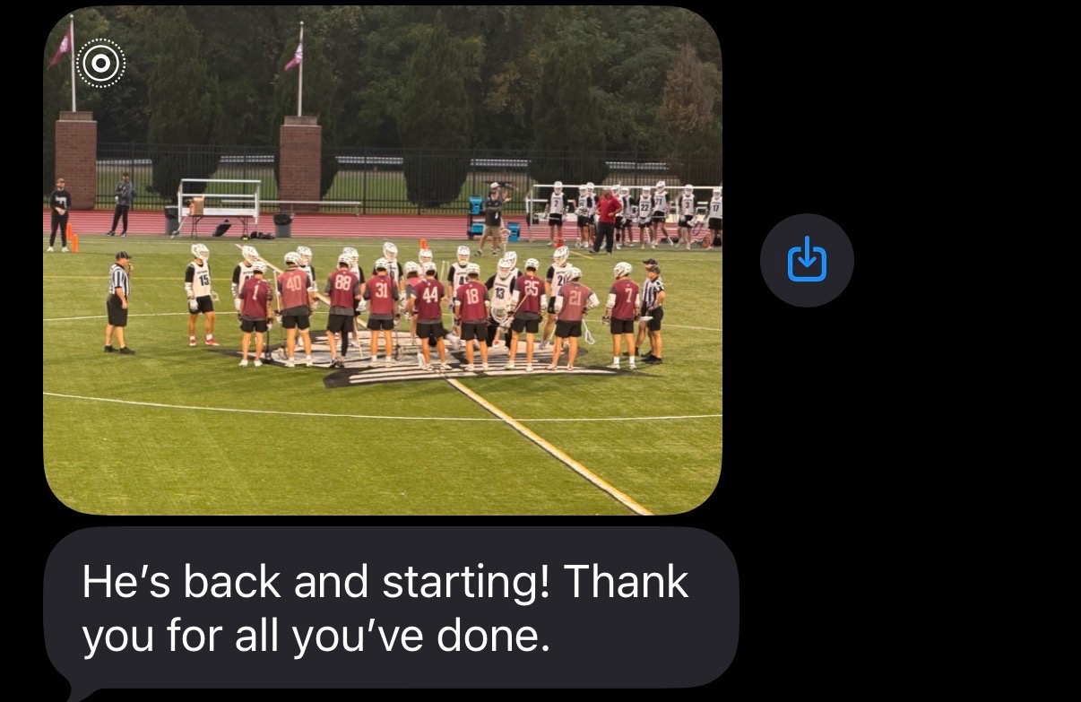 Lacrosse players gathered at midfield