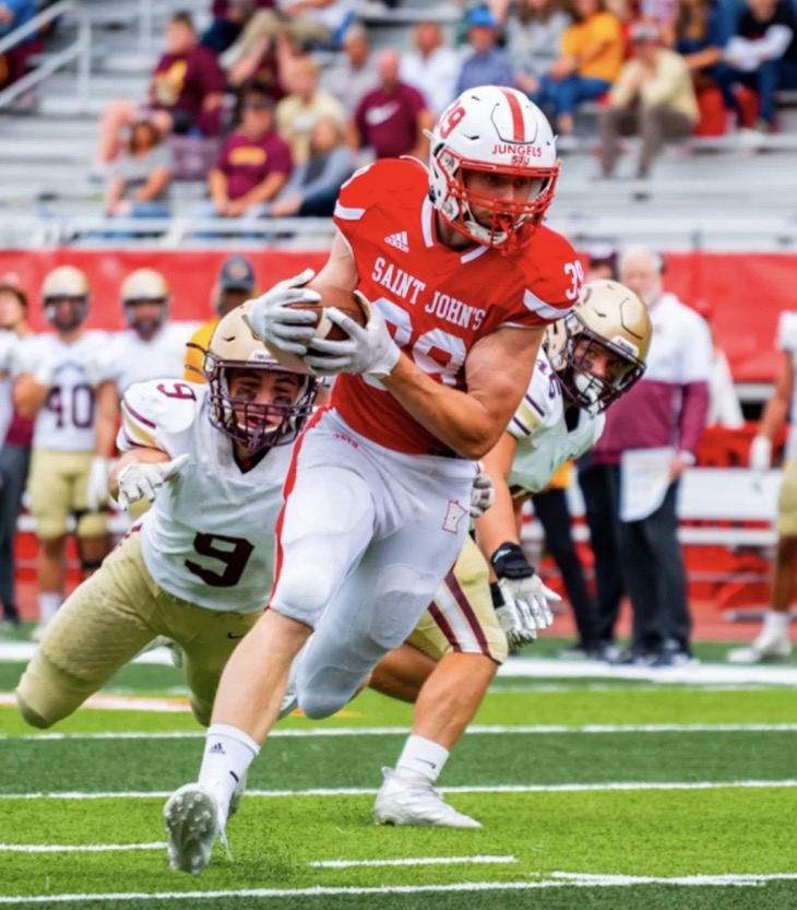 Zach Jungels carrying the ball for Saint John’s University